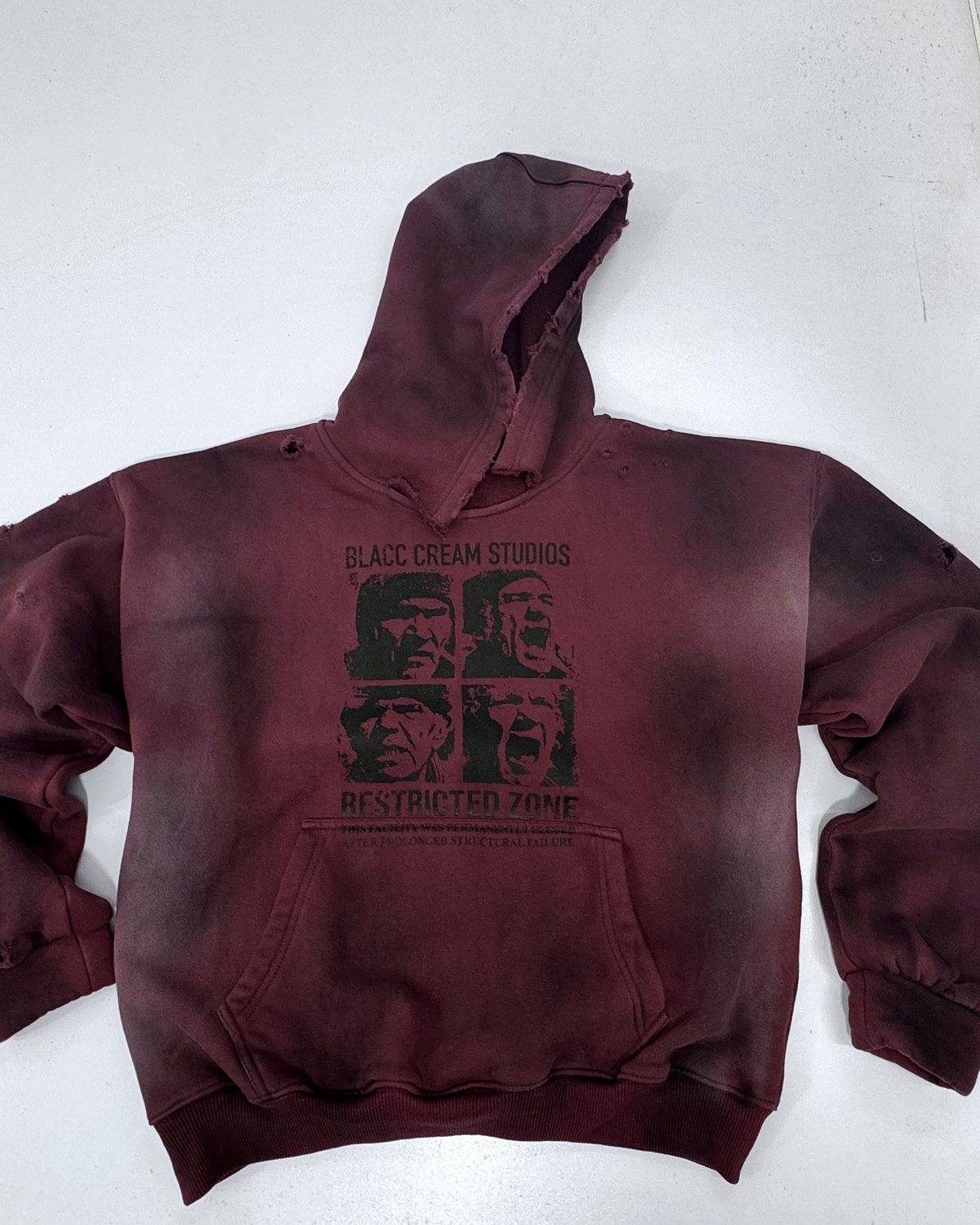 Acid-wash burgundy hoodie, the same body and print as the grey and green