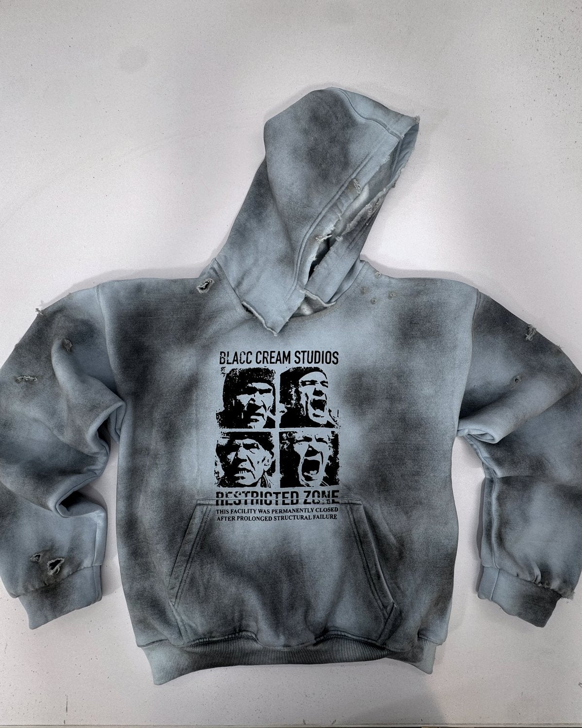 Acid-wash grey hoodie with a screen-printed front graphic